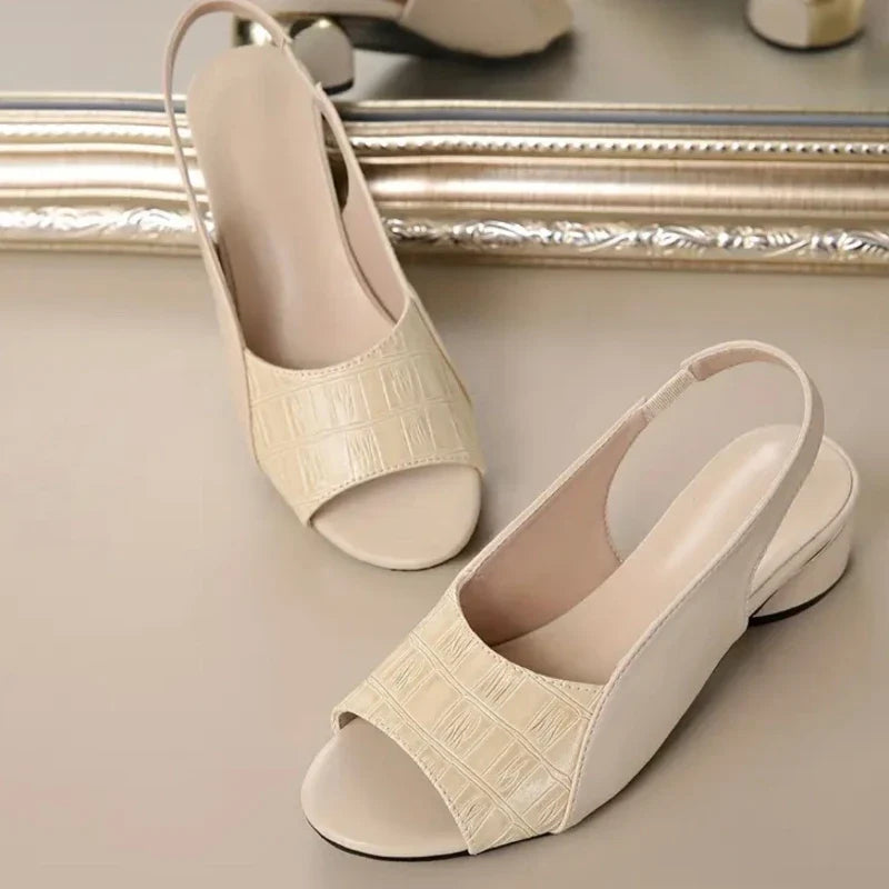 Easy slip-on women's sandals, secure slingback, comfortable block heel, fashion-forward.