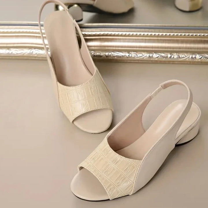 Easy slip-on women's sandals, secure slingback, comfortable block heel, fashion-forward.