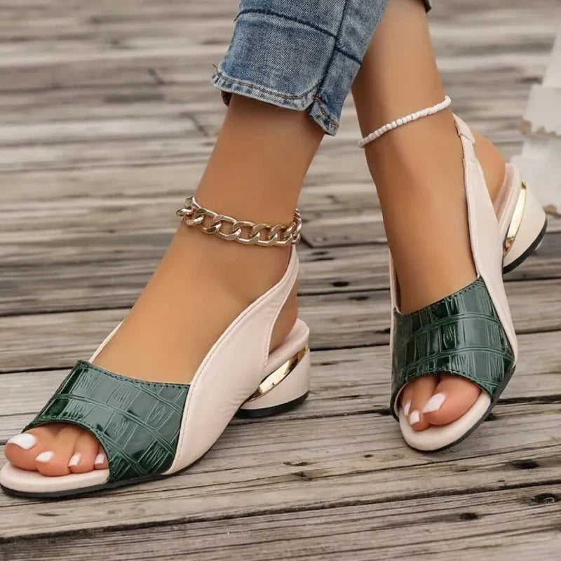 Chic women's sandals with comfortable cushioning, slingback strap & trendy croc texture.