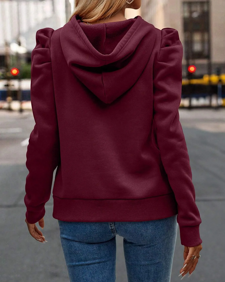 Unique stacked sleeve on a women's chic hoodie, adding a fashionable touch to any outfit.