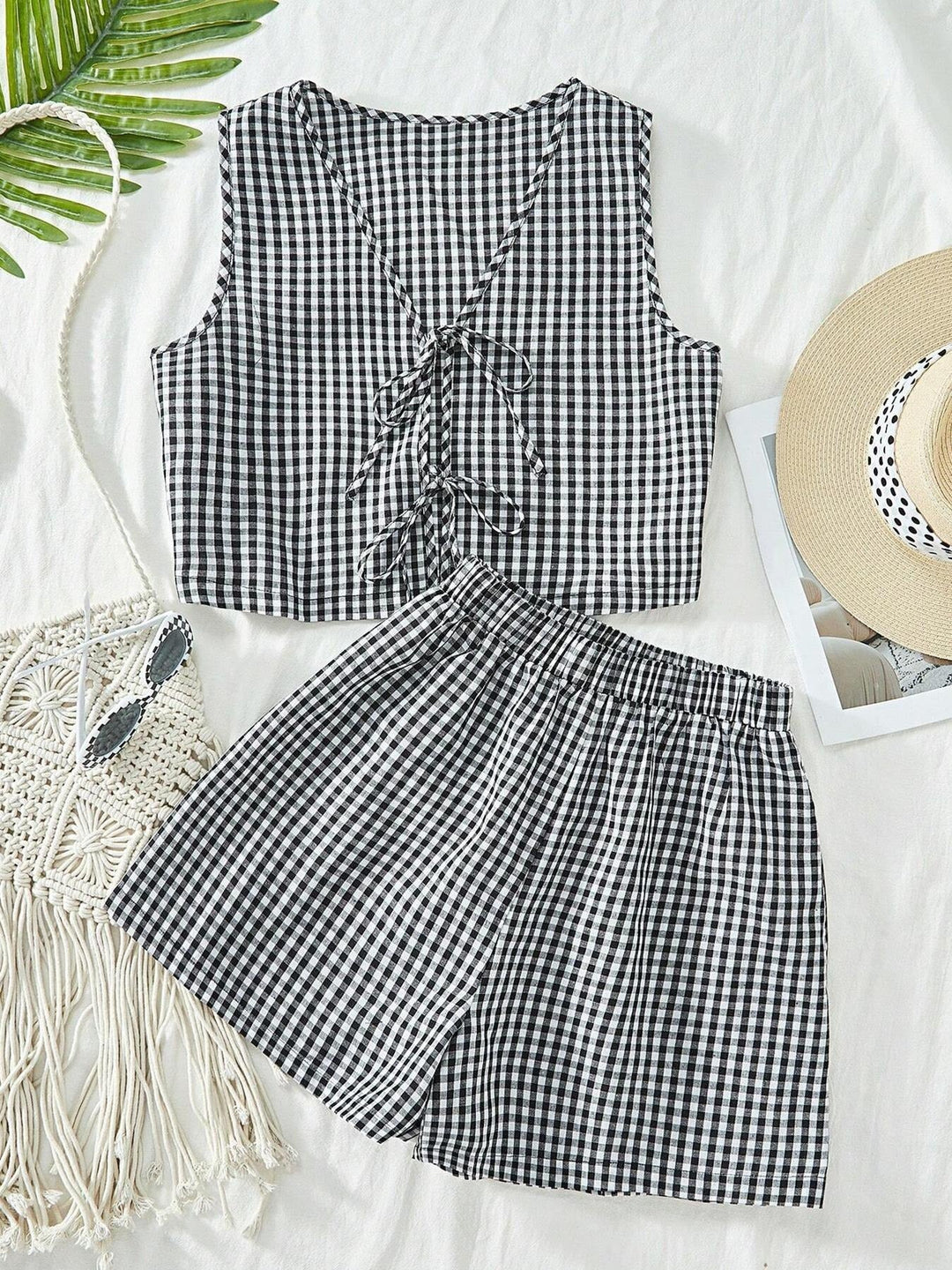 Stylish women's striped lounge set with crop top & shorts, versatile for home or casual outings.
