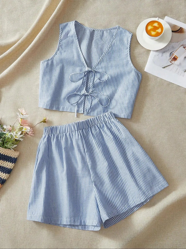Chic striped women's lounge set, a comfortable two-piece crop top & shorts perfect for summer fashion.