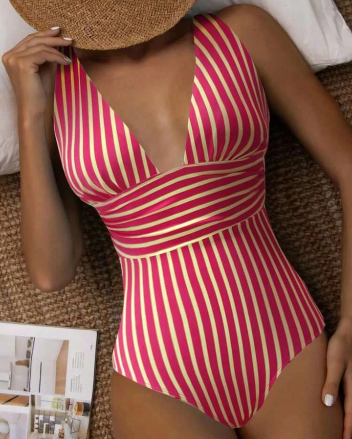Flattering & chic striped one-piece swimsuit for women, ideal summer fashion for the beach or poolside.