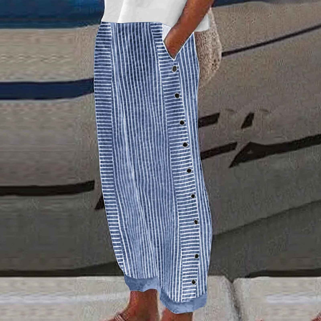 Stylish women's striped casual pants with unique button accents. Perfect for comfortable everyday spring & summer wear.