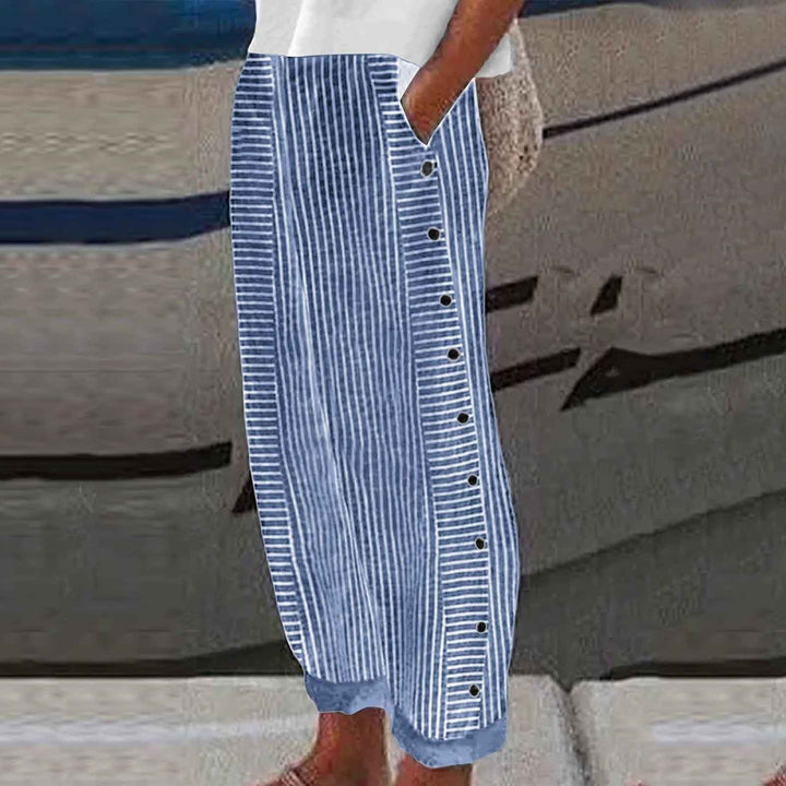Stylish women's striped casual pants with unique button accents. Perfect for comfortable everyday spring & summer wear.