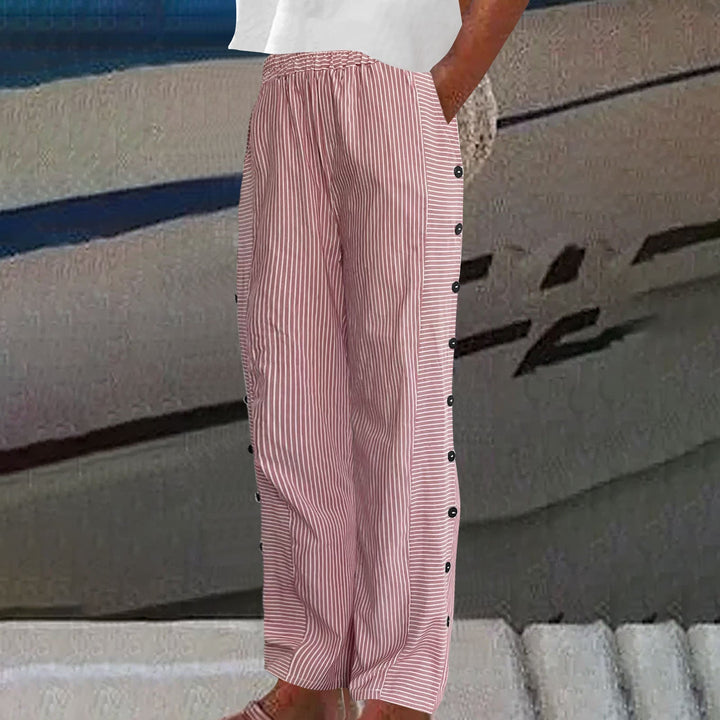 Women's striped pull-on pants with comfortable elastic waist and decorative button accents. Stylish for casual wear.