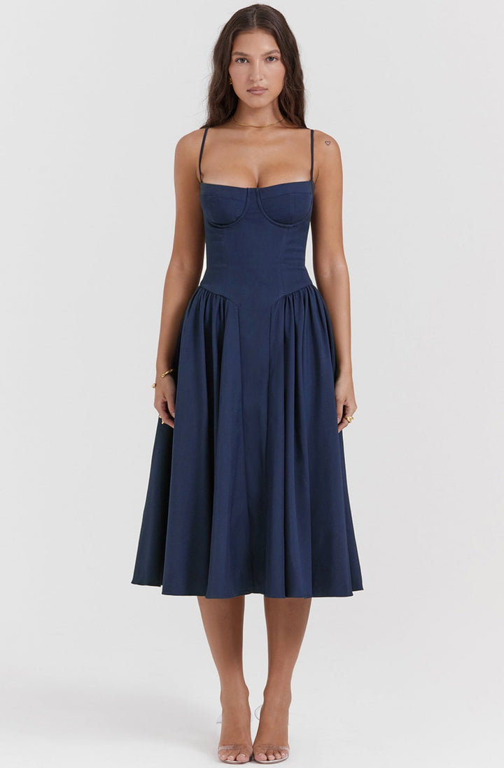 Elegant Mira summer dress featuring a cinched corset waist, spaghetti straps & flared skirt.