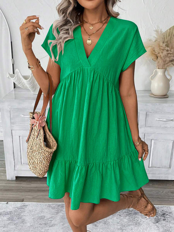 Women's chic summer mini dress with playful ruffles. Perfect for beach holidays & casual wear. Relaxed fit.