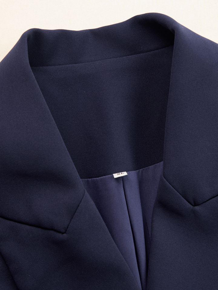 Stylish women's tailored midi dress, combining blazer details for a powerful, elegant statement.