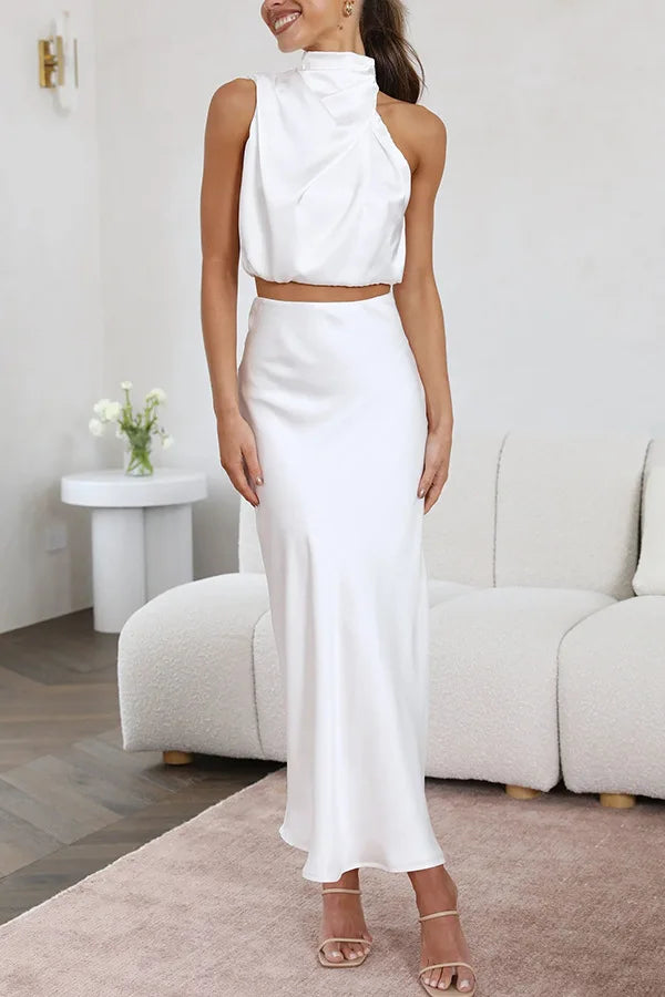 Modern women's sleeveless top and elegant skirt two-piece set, ideal for a stylish look.