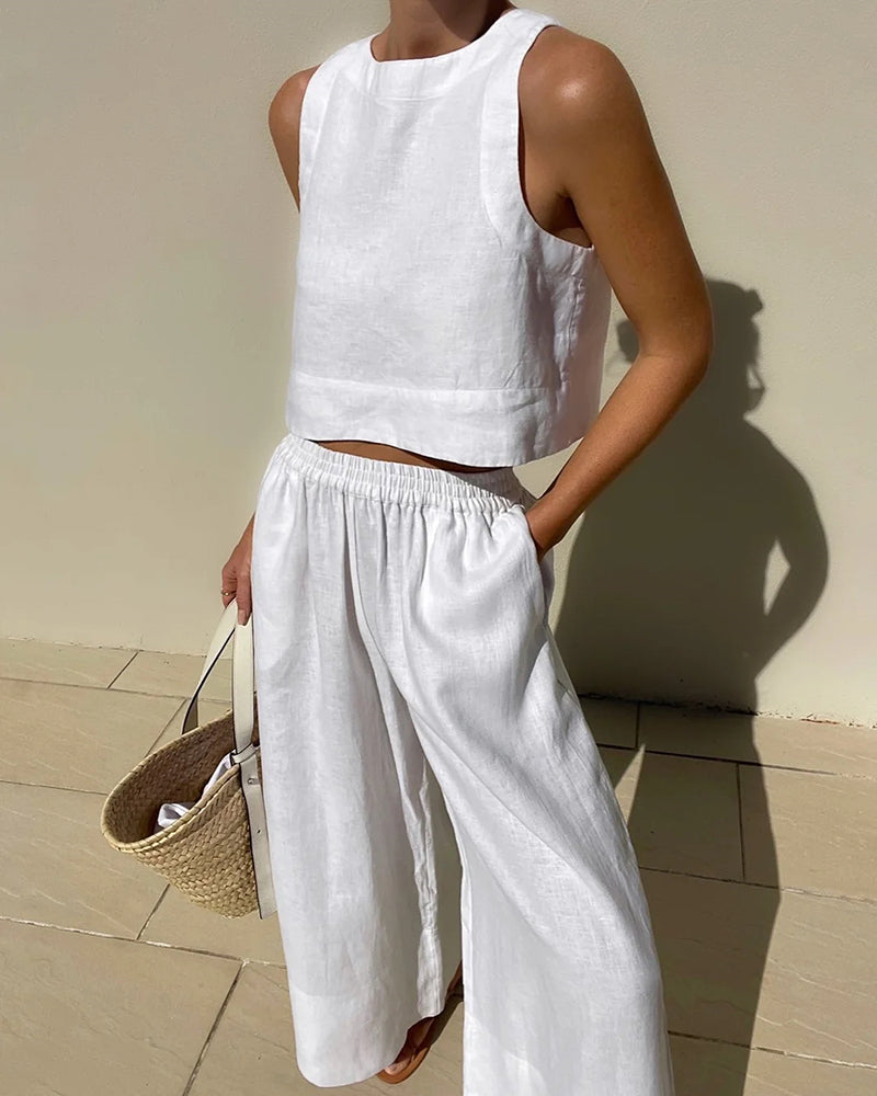 Women's chic two-piece cotton linen set featuring a crop top and wide-leg pants. Perfect for summer comfort.