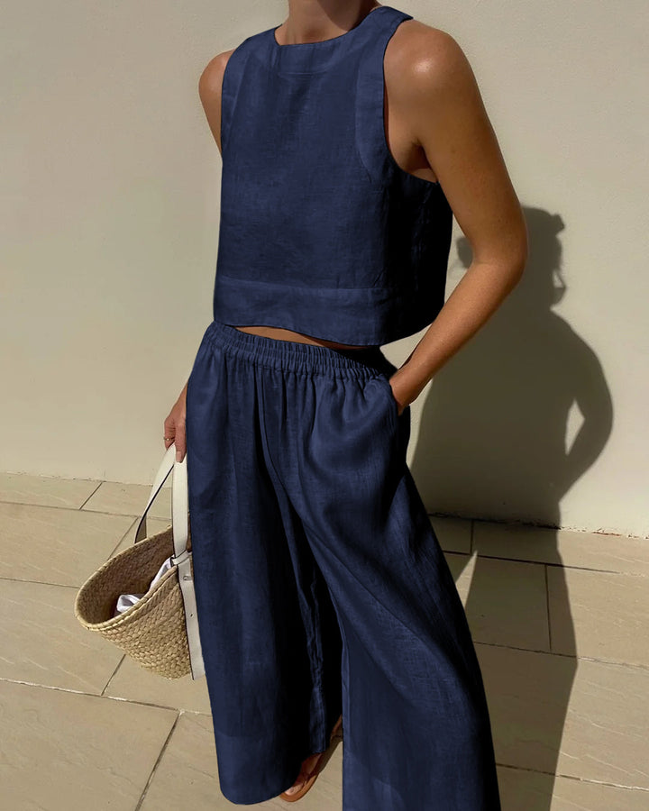 Luxe women's cotton linen two-piece set. Breathable crop top and wide-leg pants for comfortable, stylish summer wear.