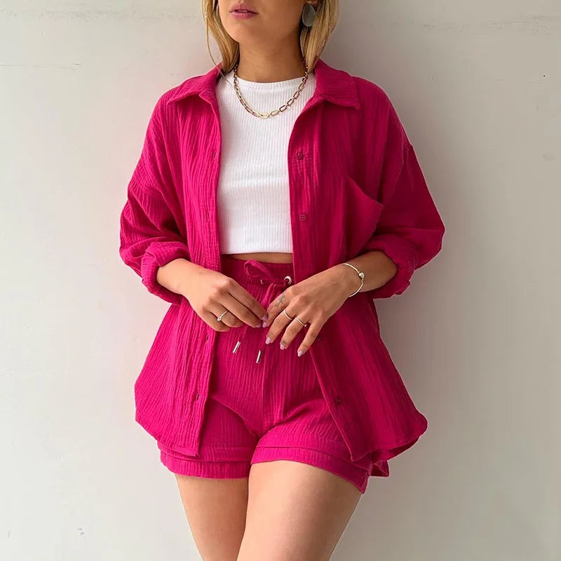 Women's vacation wear: stylish button-up shirt & matching shorts, a comfy two-piece outfit.