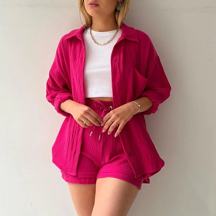 Women's vacation wear: stylish button-up shirt & matching shorts, a comfy two-piece outfit.
