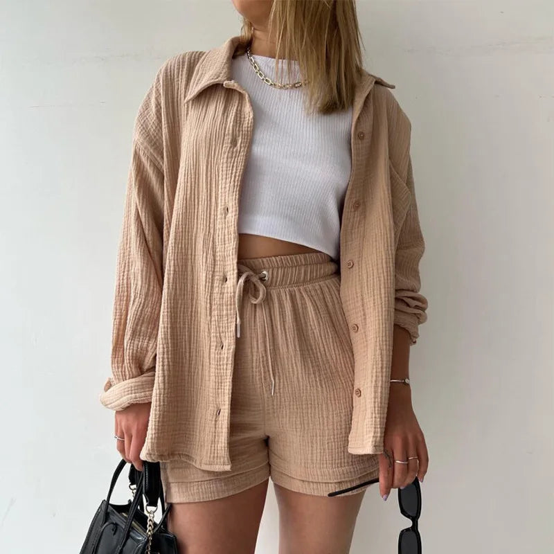Relaxed fit women's two-piece, button-up shirt & drawstring shorts, perfect for warm weather.