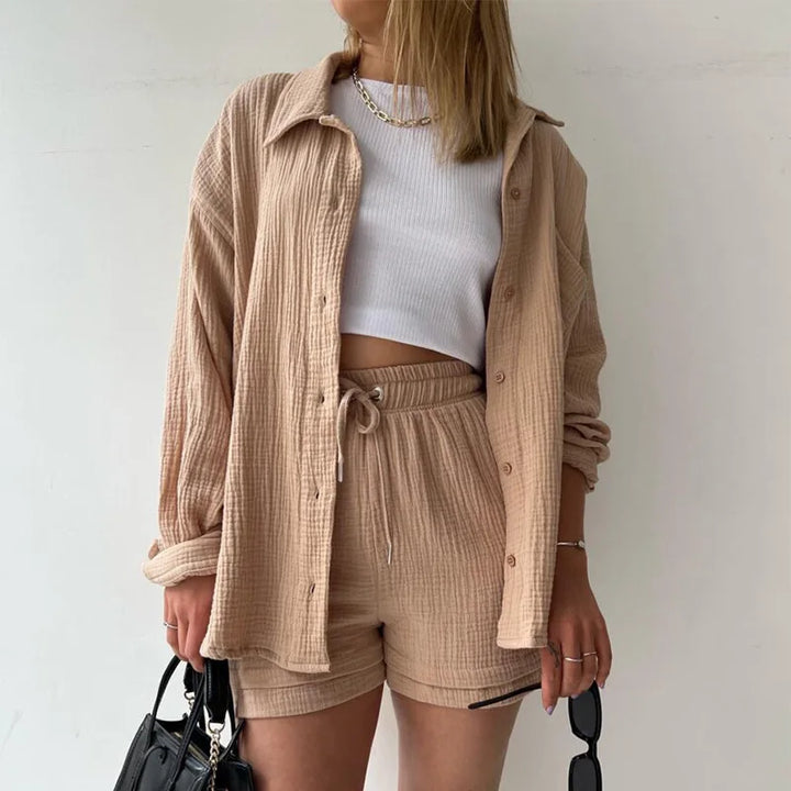 Relaxed fit women's two-piece, button-up shirt & drawstring shorts, perfect for warm weather.