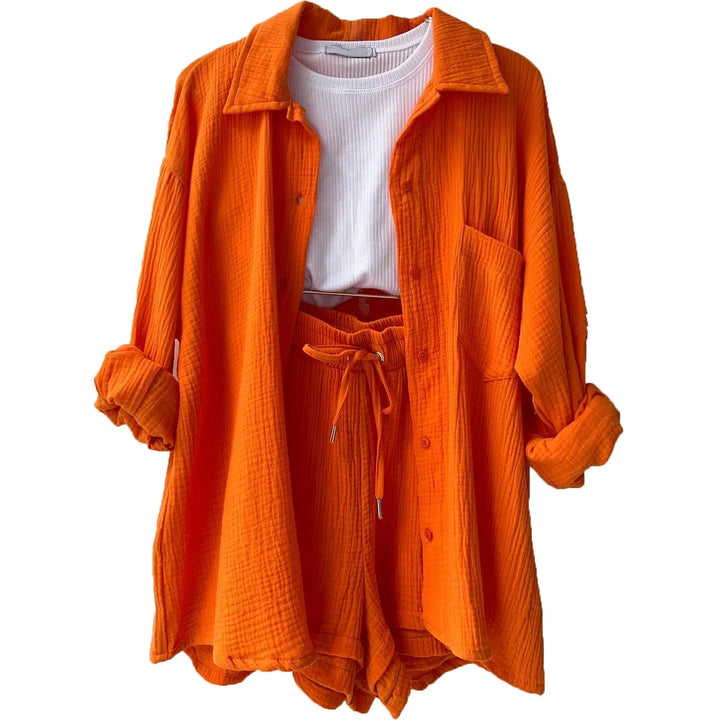 Women's vibrant loungewear set, comfy button-up shirt & drawstring shorts for ultimate relaxation.