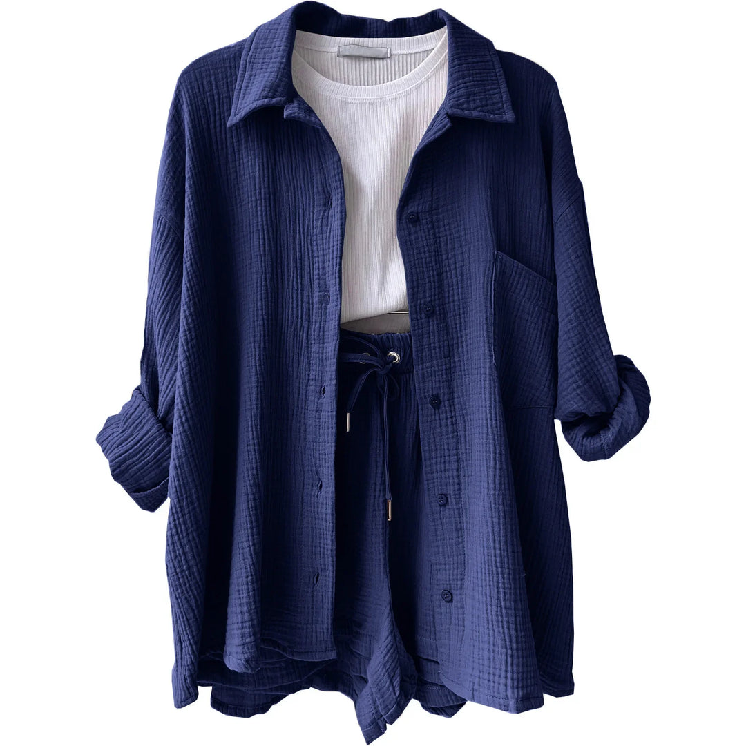 Chic women's two-piece: button-up shirt with rolled sleeves & drawstring shorts for summer.