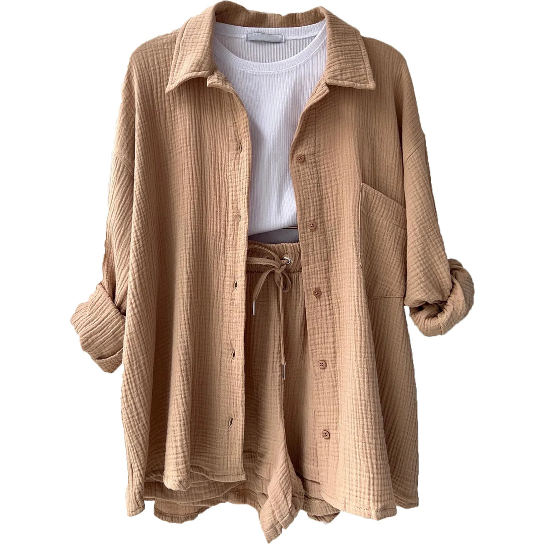 Women's holiday wear: a breezy button-up shirt & drawstring shorts, offering comfort and style.