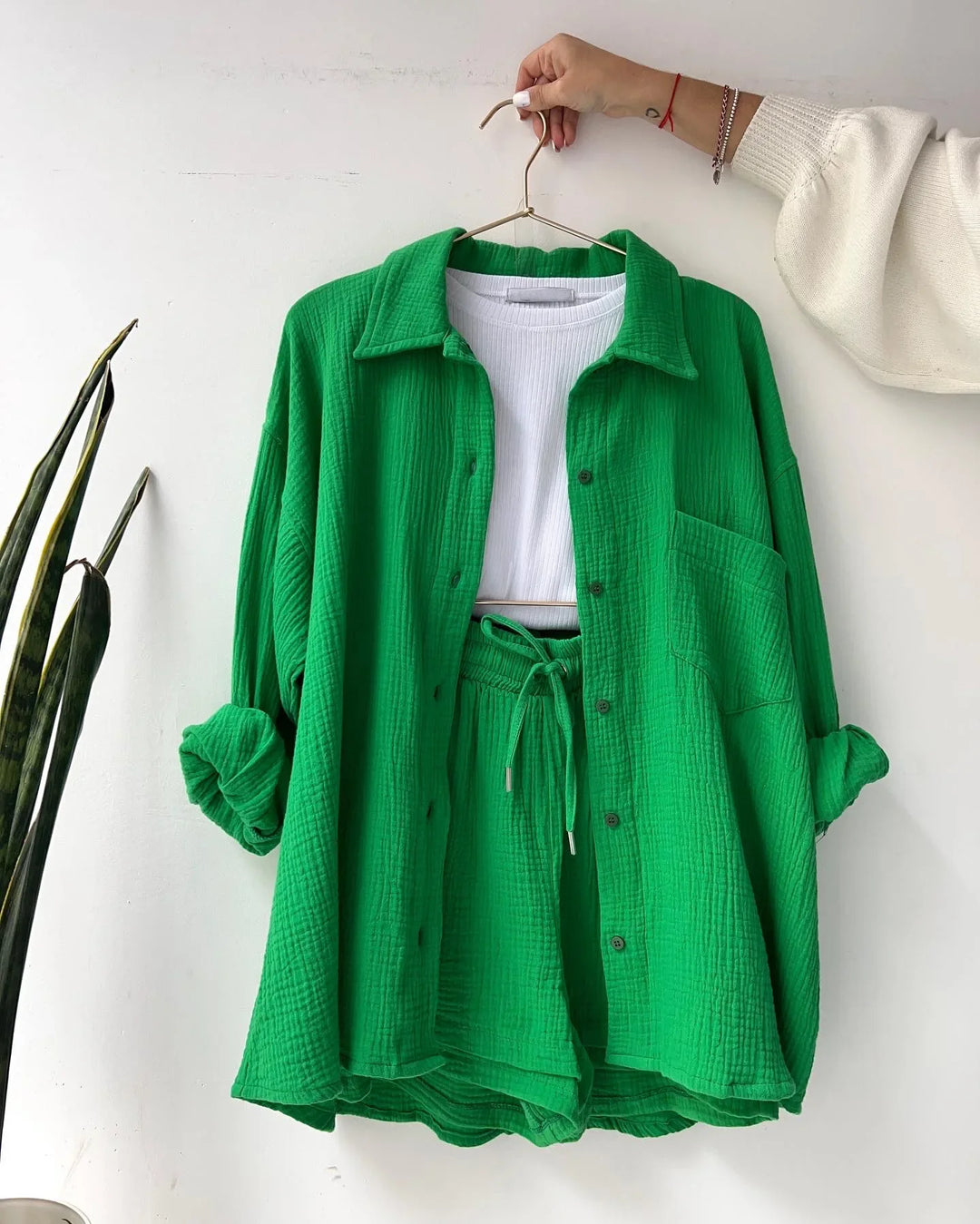 Stylish women's summer set, a button-down shirt and matching shorts, suitable for relaxed holidays.