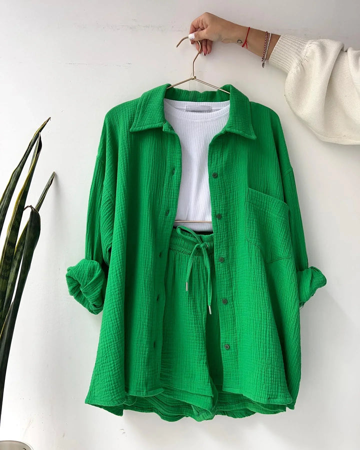 Stylish women's summer set, a button-down shirt and matching shorts, suitable for relaxed holidays.