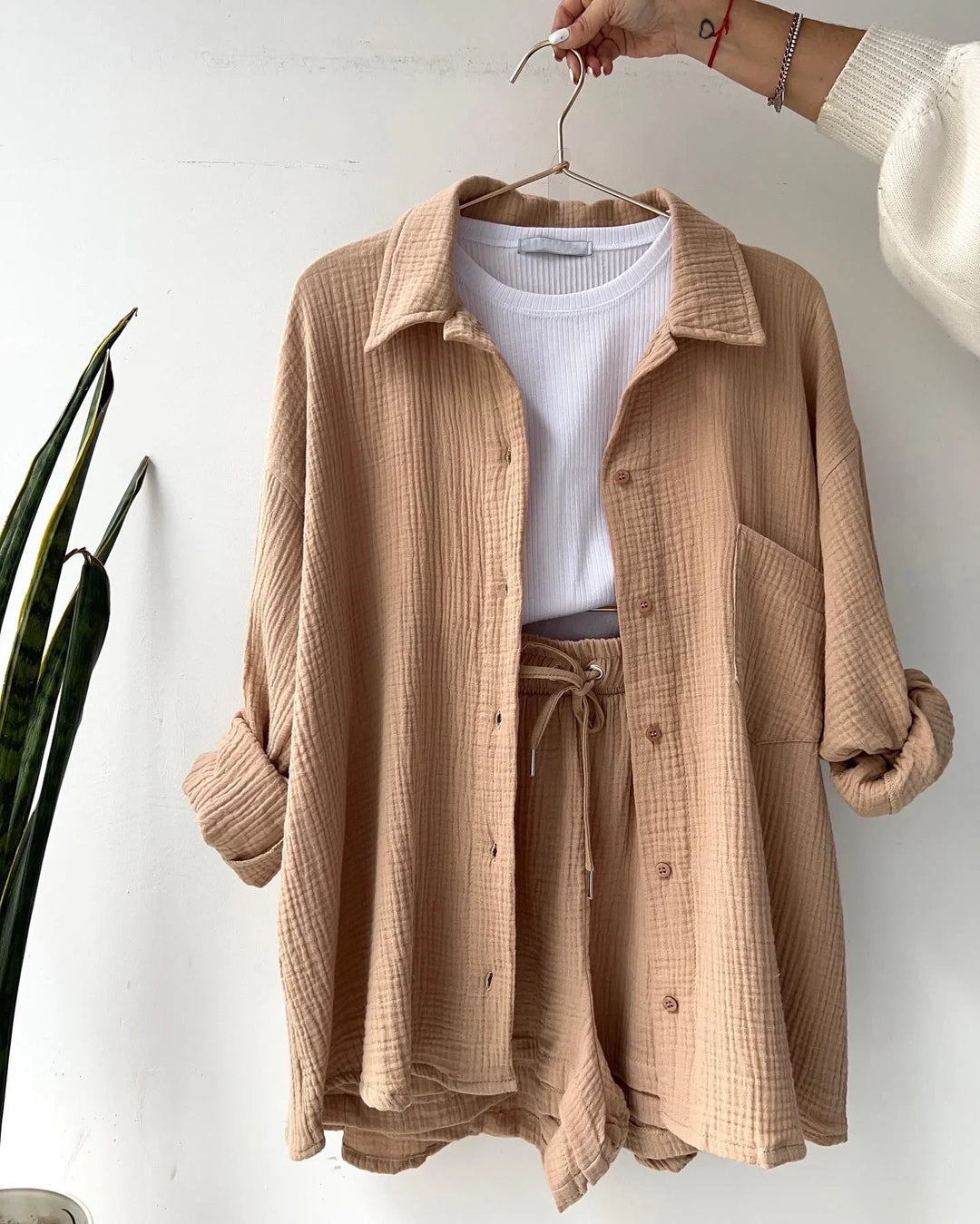 Women's casual matching set: buttoned shirt & comfy shorts, perfect for sunny beach days.