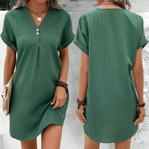Stylish women's V-neck summer dress, accessorized for a chic, versatile day-to-night fashion look. Midi length.