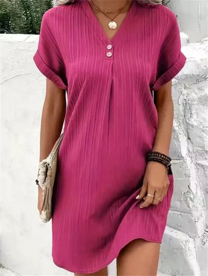 Model wearing a flowing women's V-neck summer comfort dress, showcasing its elegant midi length and versatile style.