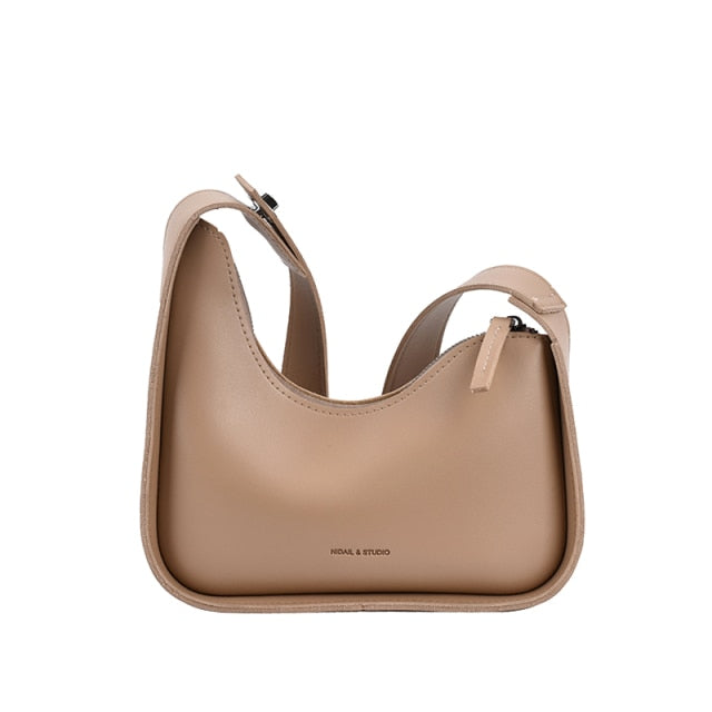 Women's Chic Wave Design Shoulder Bag in PU leather, a stylish fashion accessory for everyday use.