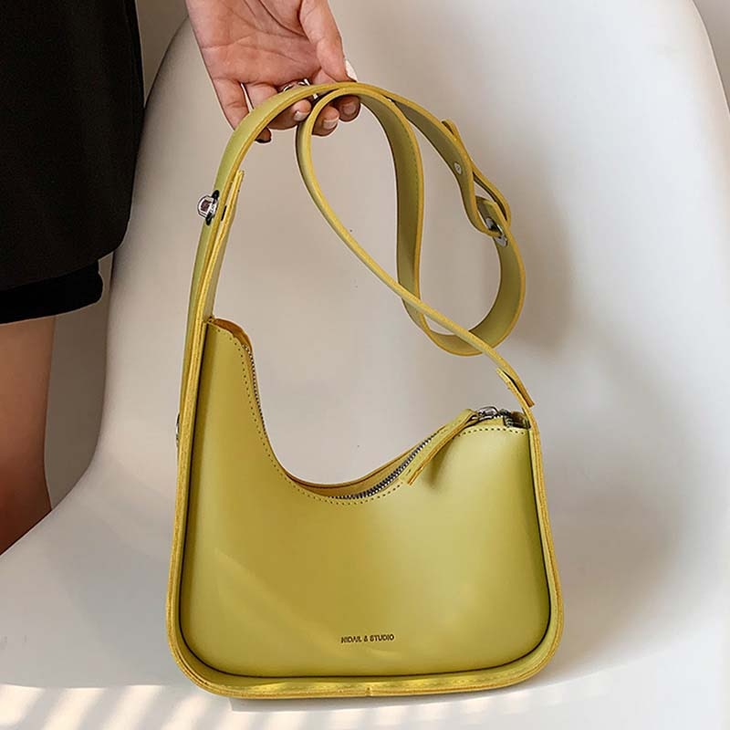 Khaki wave design PU leather shoulder bag for women, a versatile and chic everyday handbag accessory.