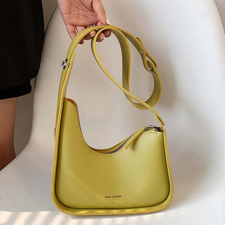 Khaki wave design PU leather shoulder bag for women, a versatile and chic everyday handbag accessory.