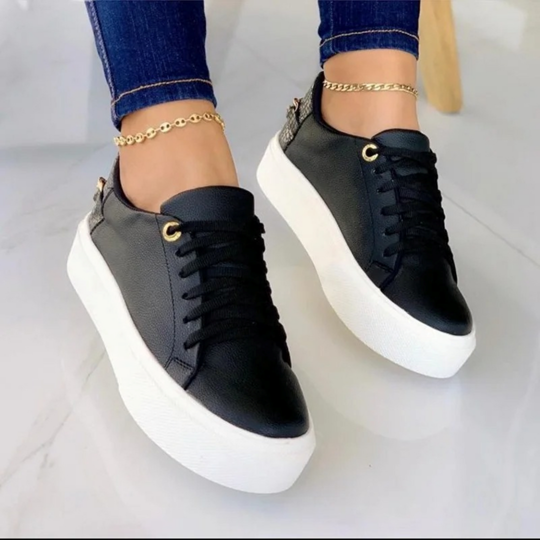 ComfortStep white leather women's sneakers featuring a stylish metal chain, ideal for walking & fashion.