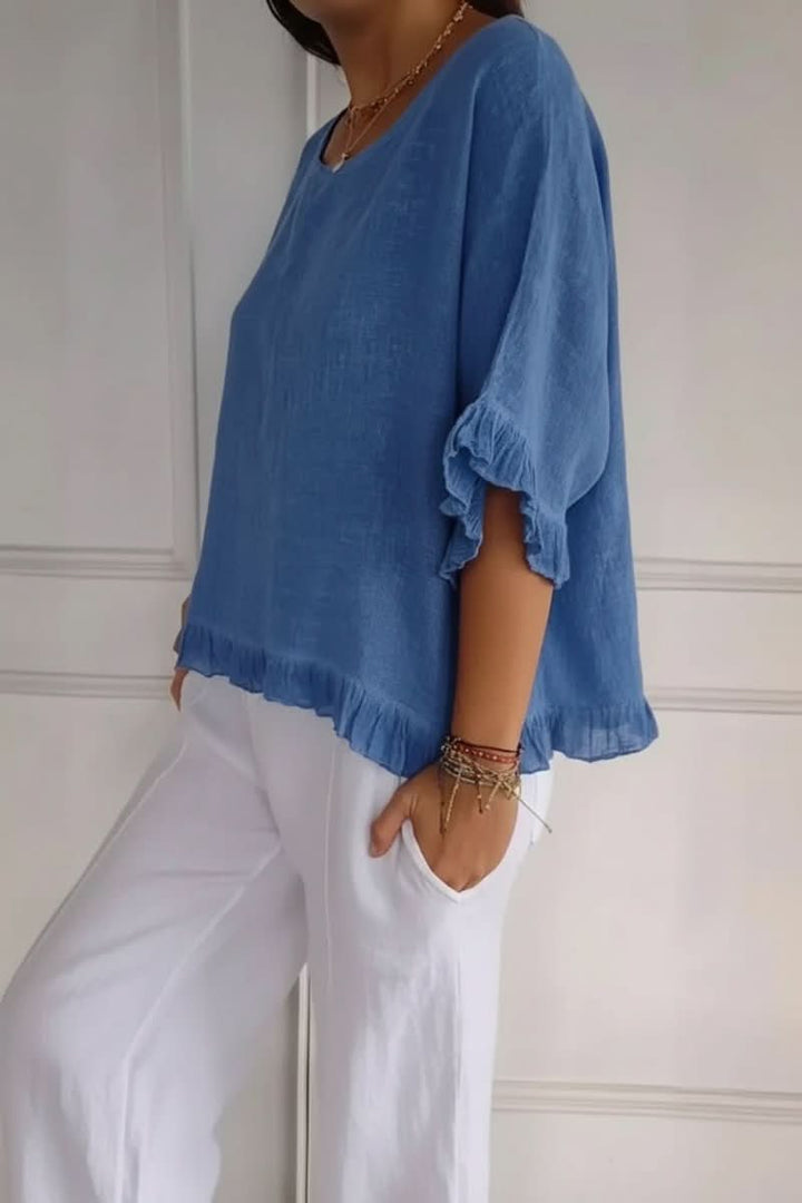 Versatile women's ruffle blouse, soft fabric, ideal for effortless casual wear or smart office outfits.