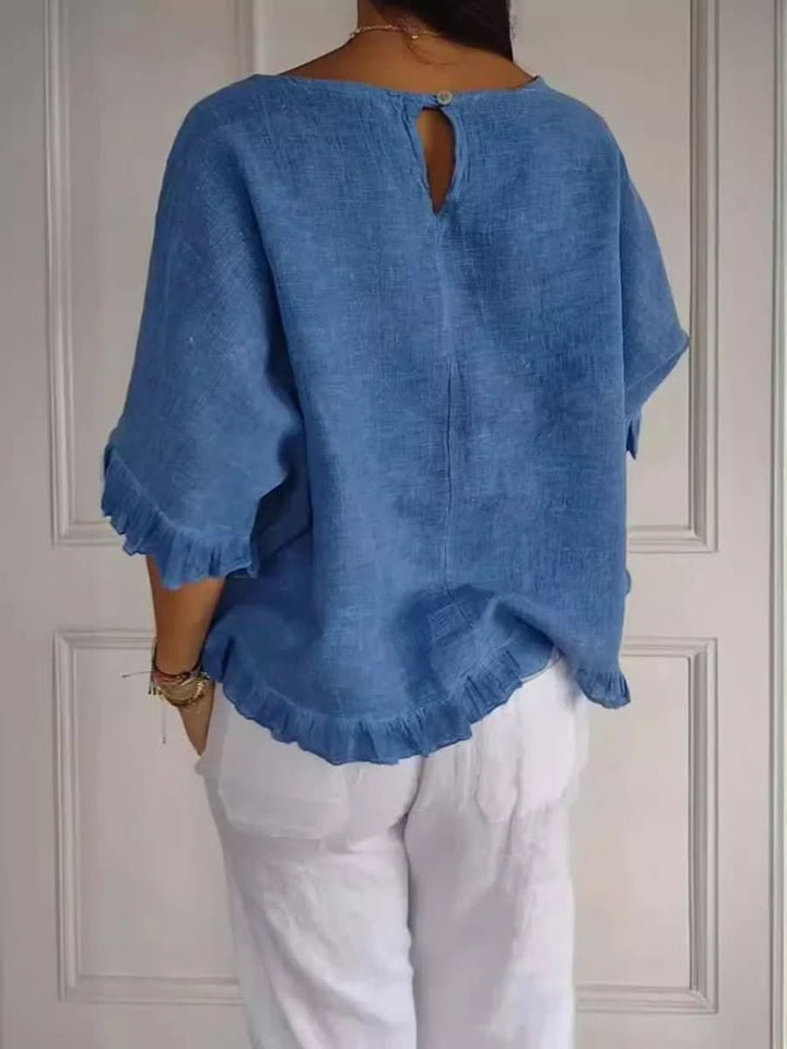 Lightweight women's ruffle top for summer, offering a chic and comfortable fit for any occasion.