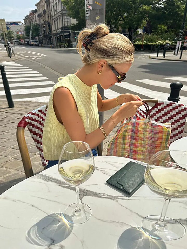 Elegant yellow sleeveless top for women, comfortable & breathable. A stylish summer wardrobe essential with a chic round neck.