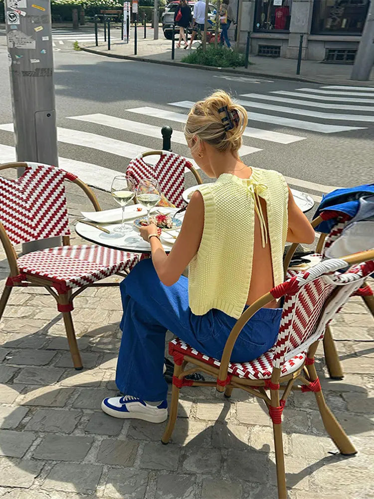 Lightweight yellow knit top for women, sleeveless and chic. Ideal for summer fashion, casual yet elegant with a round neck.