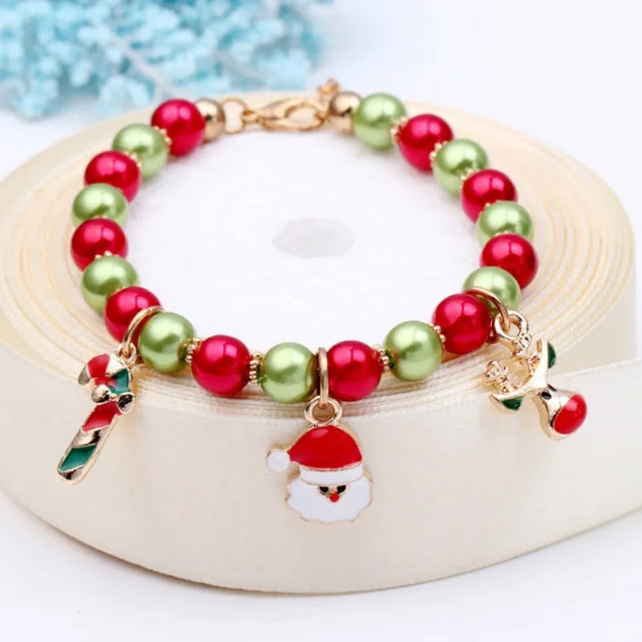 Elegant women's Christmas bracelet, a perfect holiday gift, adorned with Santa Claus & decorative beads.