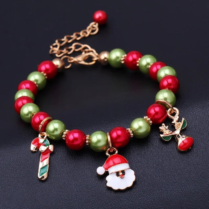 A hand wearing a beautiful Christmas Santa bead bracelet, showcasing its vibrant colors and detailed holiday charms.