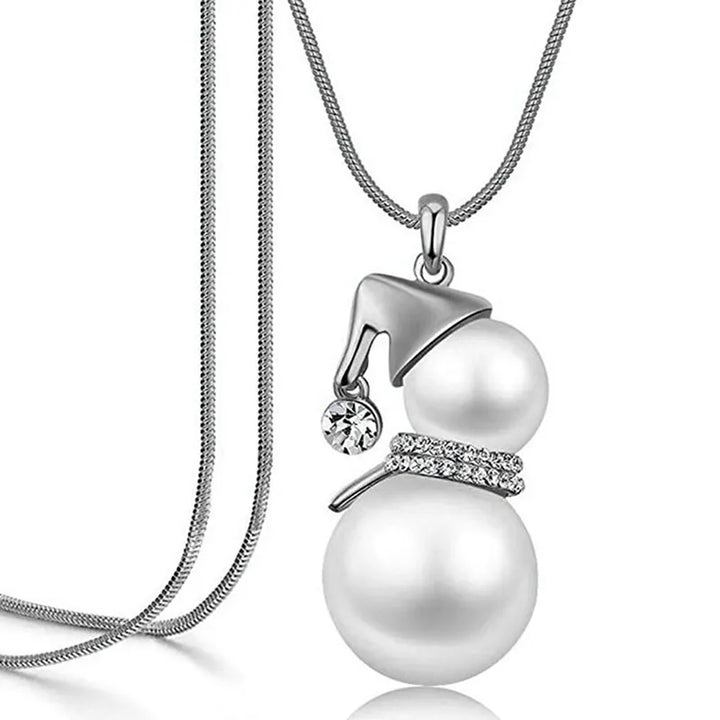 Elegant Christmas snowman pearl necklace, featuring a cute snowman charm and lustrous pearls.