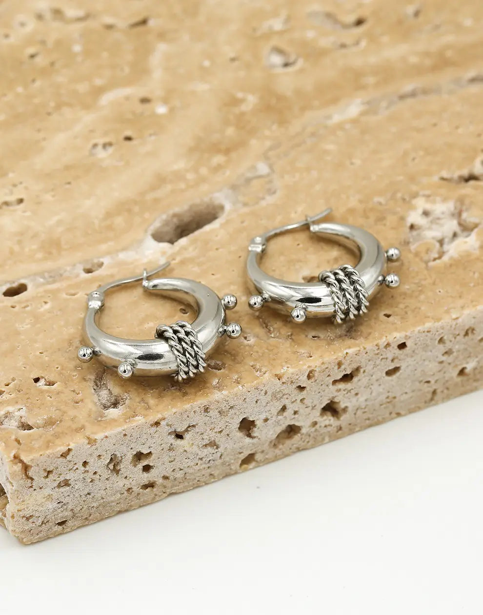 Fashionable chunky Bali hoop earrings, offering a bold and elegant women's jewelry accessory in gold/silver.