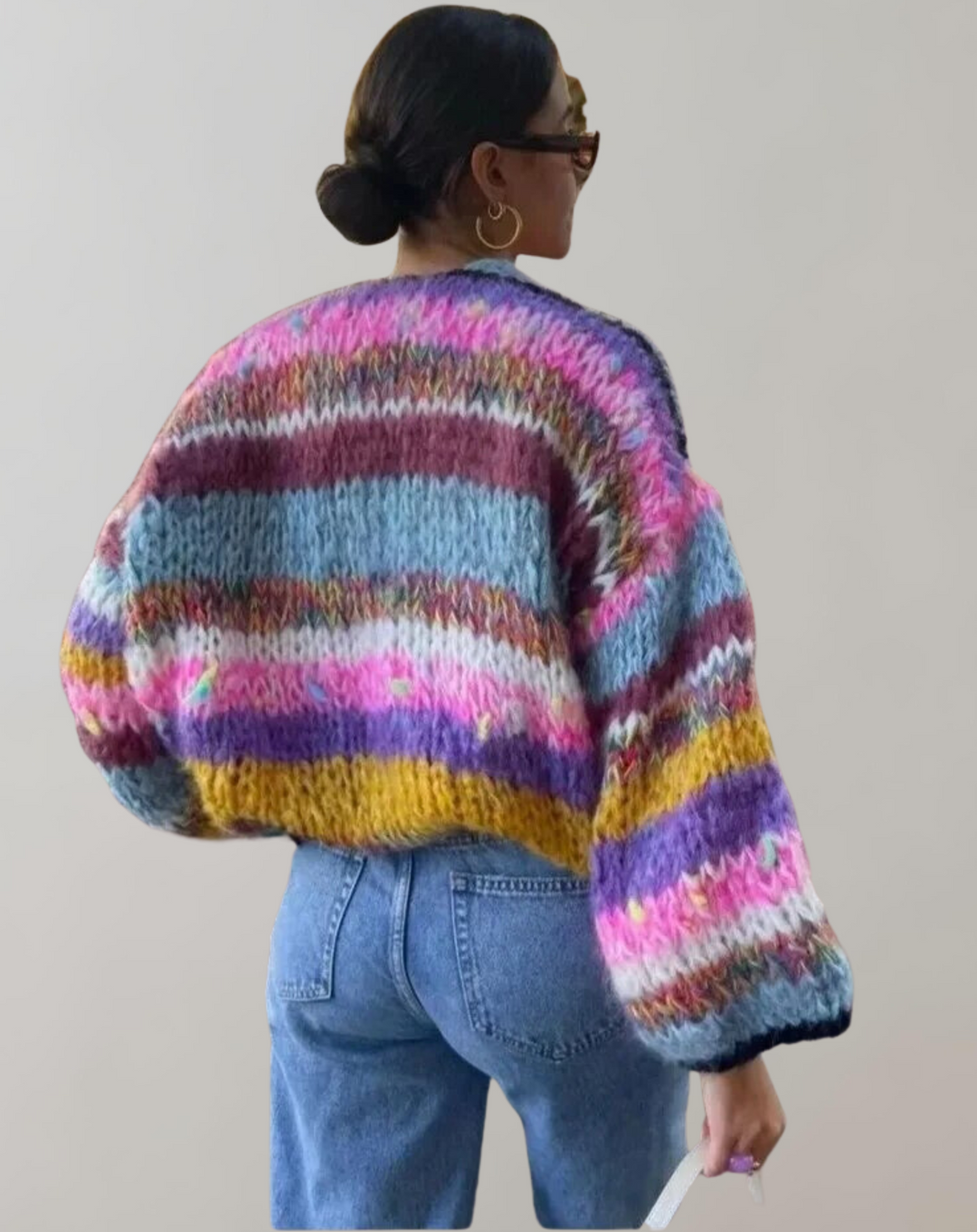 Full shot of a women's chunky knit Lotta cardigan, an essential open front sweater for casual winter outfits