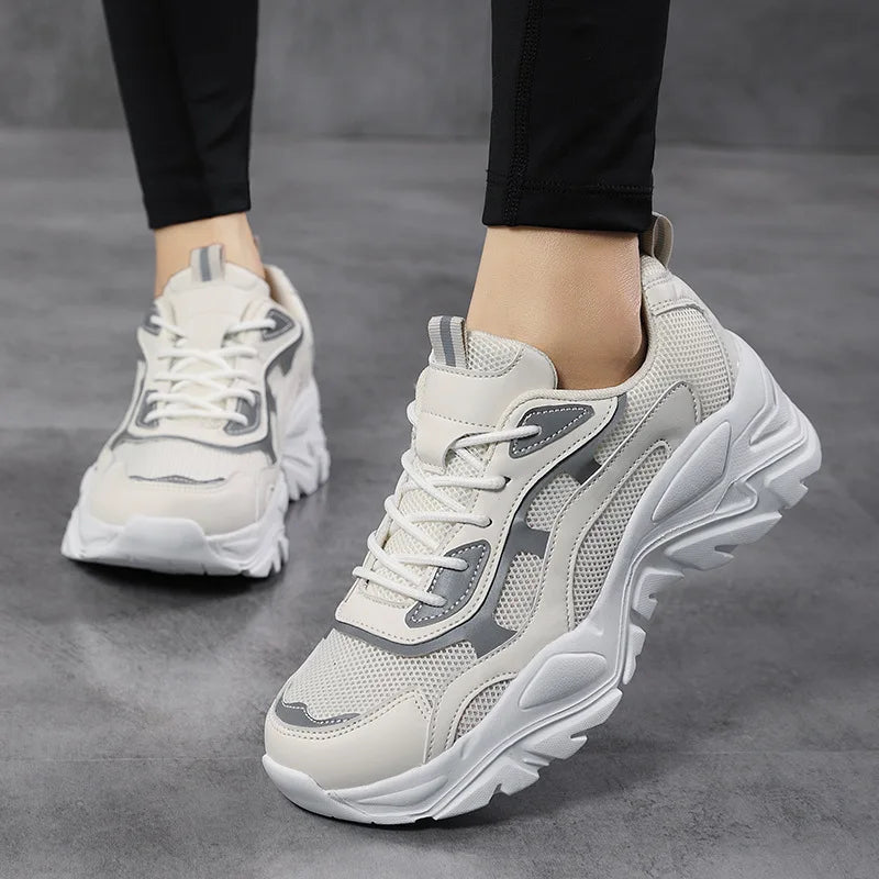 Women's chunky platform sneakers with mesh upper, ideal for elevated street style & casual fashion.