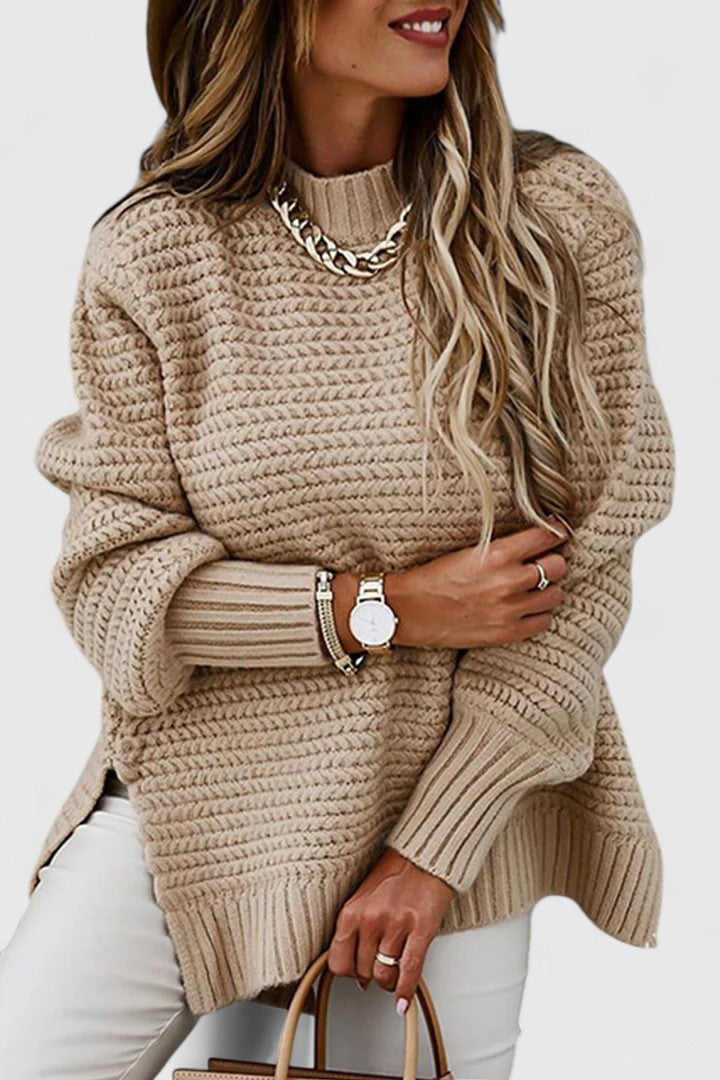 Cozy women's oversized chunky ribbed mock neck sweater, ideal for warmth and comfort in cold weather.