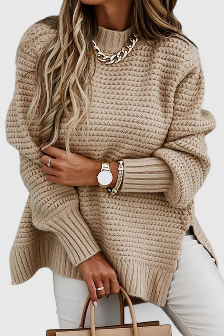 Fashionable women's oversized chunky ribbed sweater in a mock neck design, perfect for a cozy and warm fall outfit.