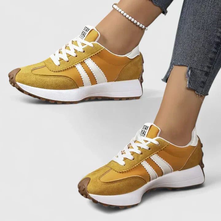 Sporty women's lace-up sneakers with chunky sole, perfect for gym, running, and comfortable active wear.