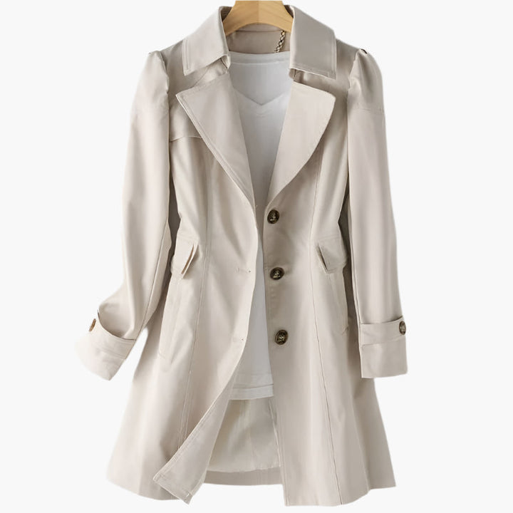 Close-up of a women's classic trench coat, highlighting the tailored fit & quality fabric. Timeless style outerwear.