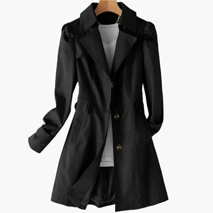 Full-length view of a women's classic trench coat. Versatile, elegant outerwear suitable for professional wear.