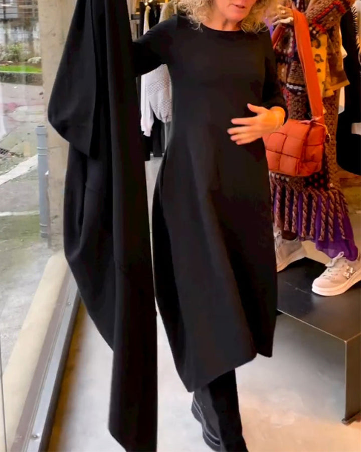 Versatile women's black midi dress. Long-sleeve, A-line cut offers comfort & timeless style for fall, winter, spring.