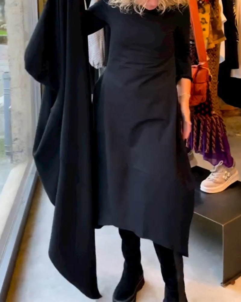 Elegant women's black midi dress. Classic A-line, round neck, long sleeves. Perfect for casual or semi-formal wear.