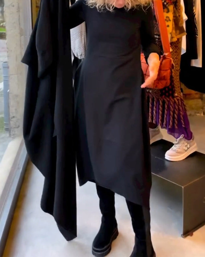 Black midi dress for women. Long-sleeve, round neck, A-line. Ideal for fall, winter, and spring fashion outfits.